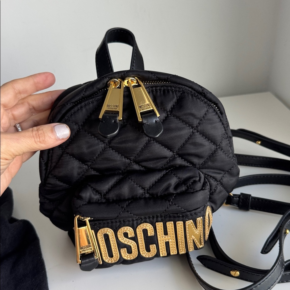 Moschino Black Quilted Crossbody with Gold Accents.